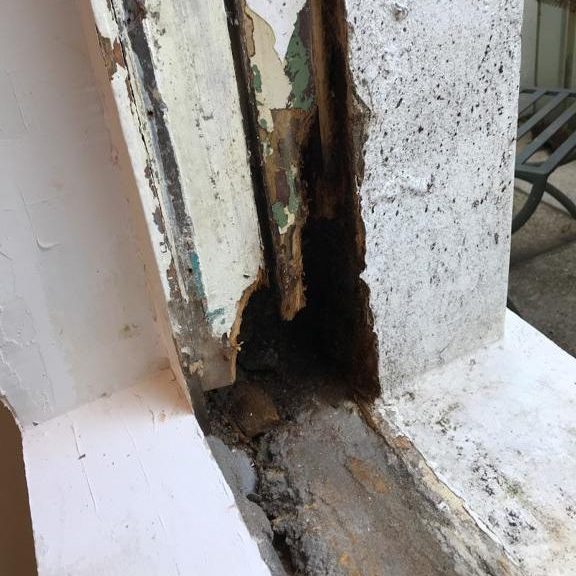 Close up of old, rotten and broken sash window frame