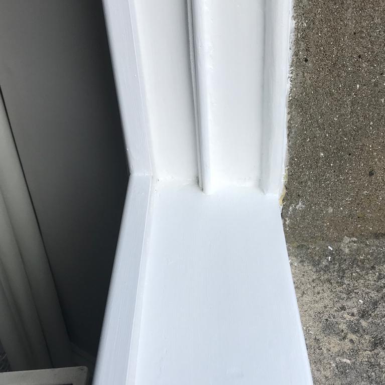 Close up of repaired and repainted window sill